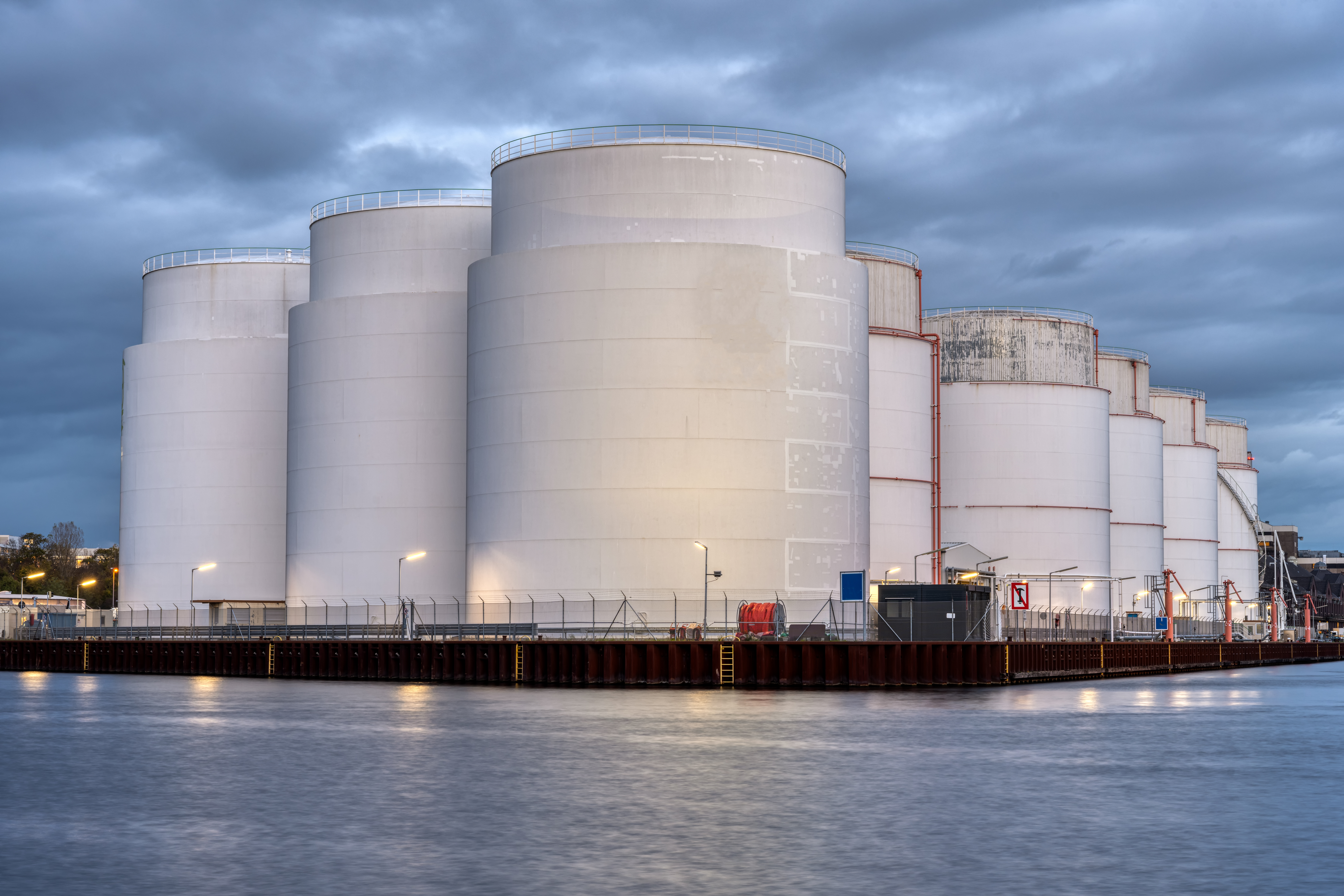 storage-tanks-for-fossil-fuels-at-dusk-2023-11-27-05-29-40-utc